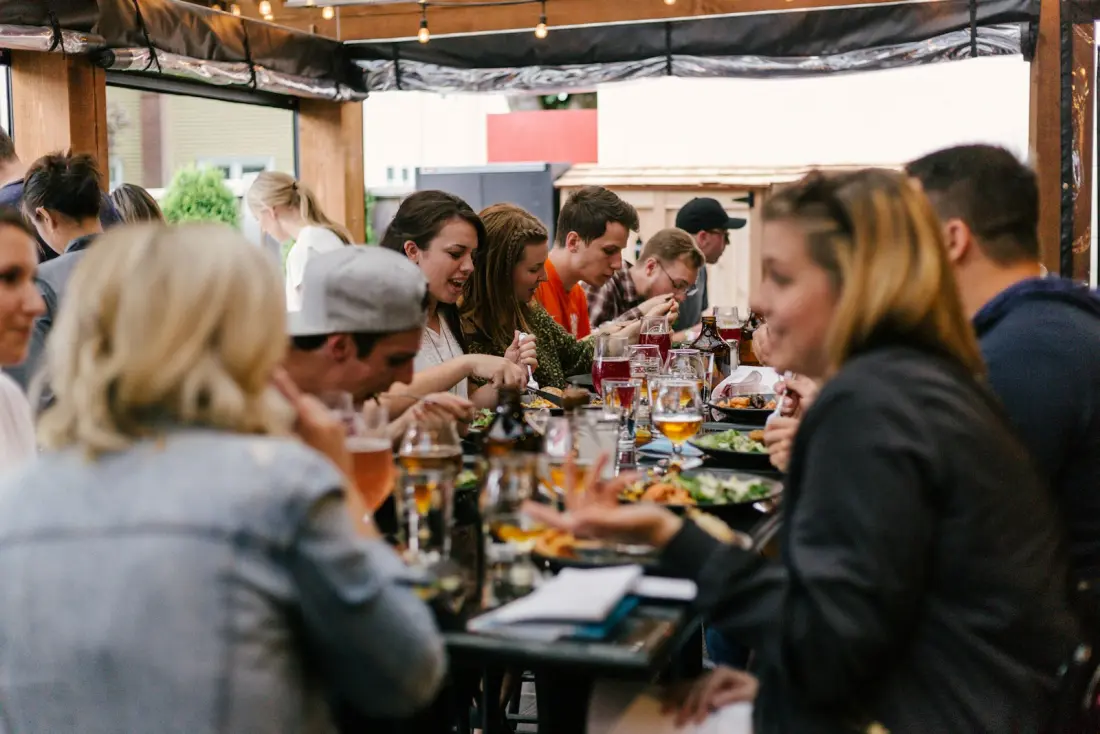 A full restaurant of guests dining together