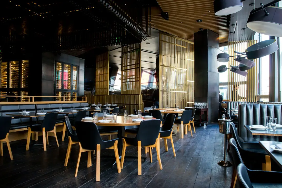 Modern restaurant dining room set for service