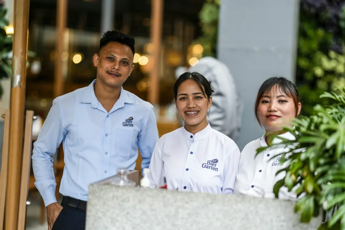 Smiling restaurant team standing together